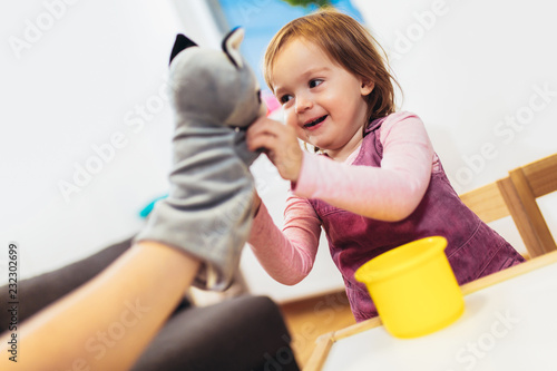 Cute child playing on table indoor