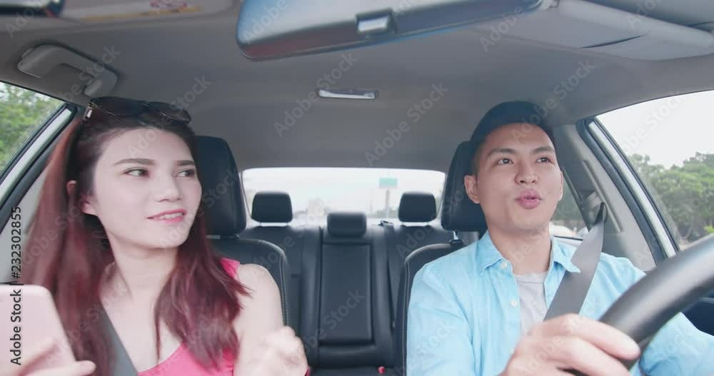 couple enjoy music while driving couple enjoy music while driving