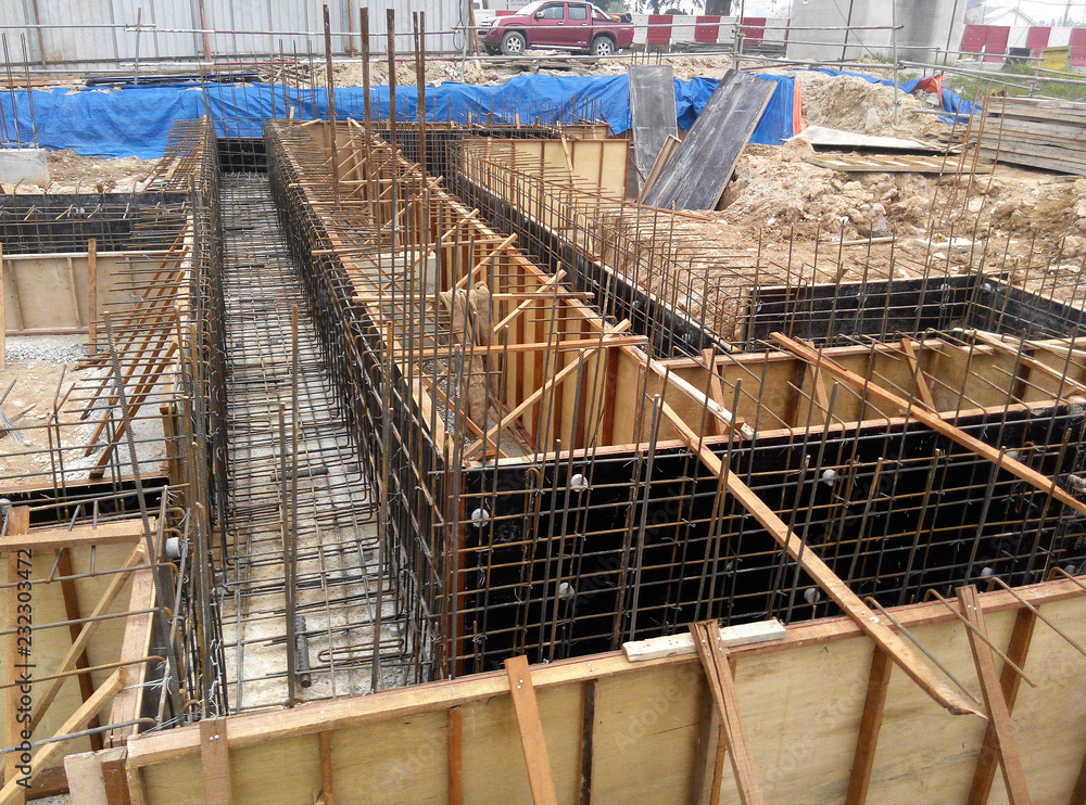 Ground beam form work constructed by workers at the construction site