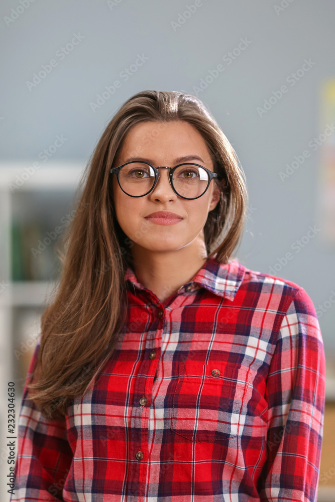 Close up of beautiful woman in glasses lookting at office space behind her. Indoor. Portrait
Close up of beautiful woman in glasses lookting at office space behind her. Indoor. Portrait