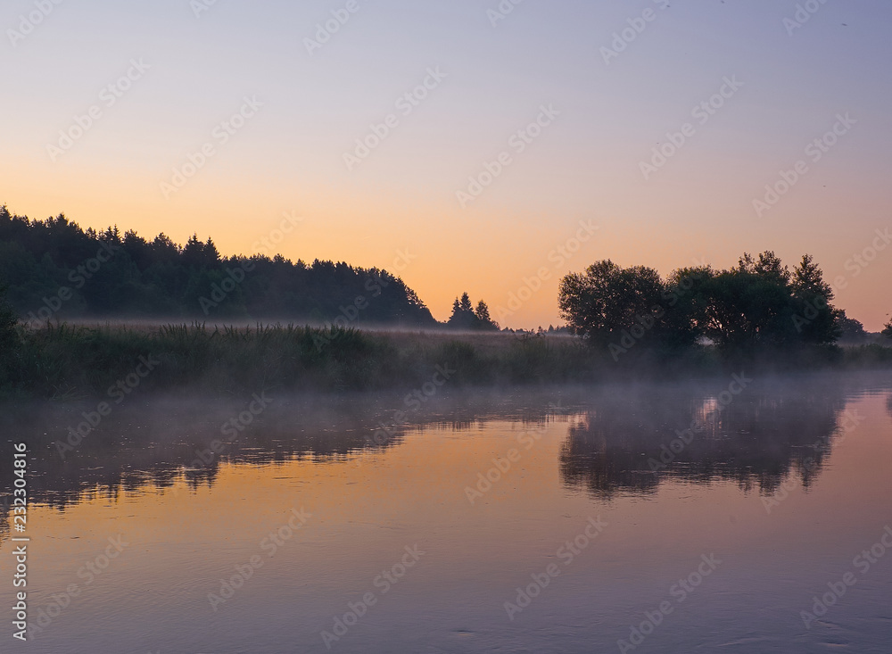 Calm sunrise on the beautiful lake