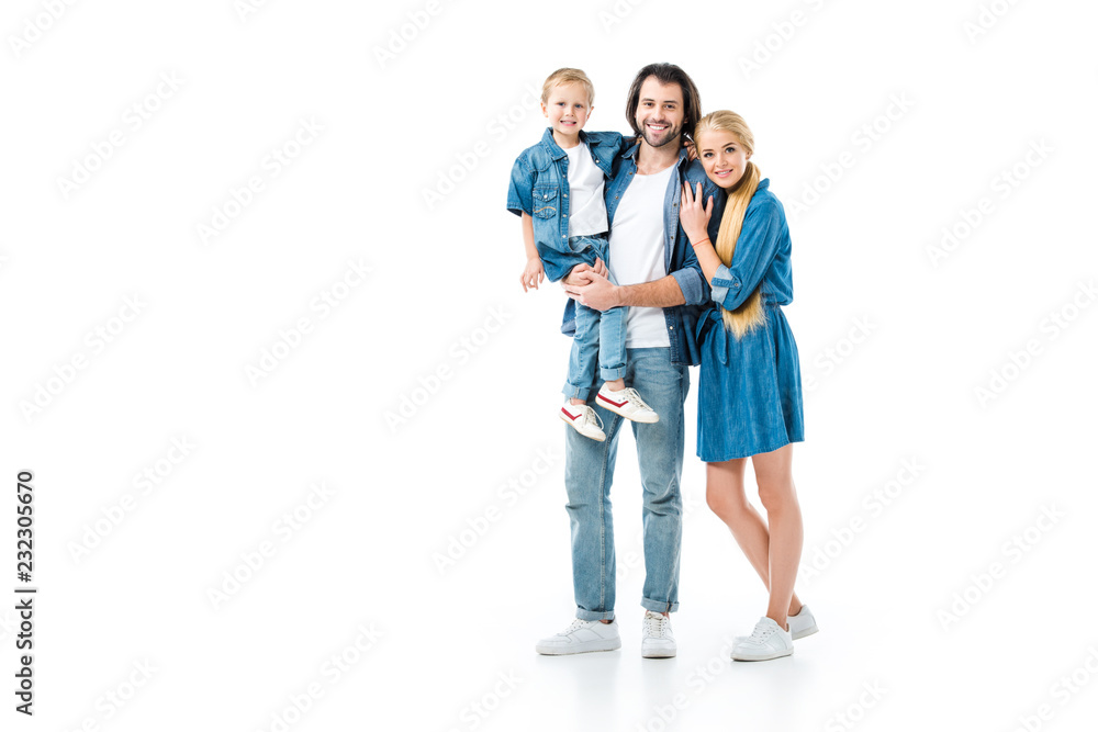 Beautiful family hugging and wearing denim clothes isolated on white