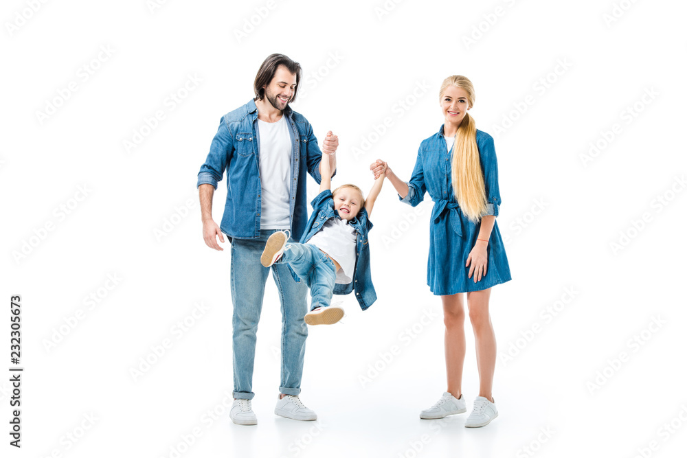 Lovely parents throwing up their child while holding hands isolated on white Lovely parents throwing up their child while holding hands isolated on white
