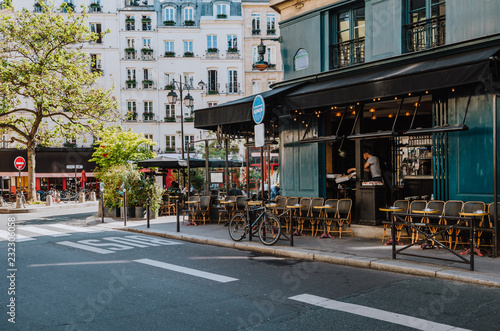 Cozy street with tables of cafe  in Paris, France © Ekaterina Belova