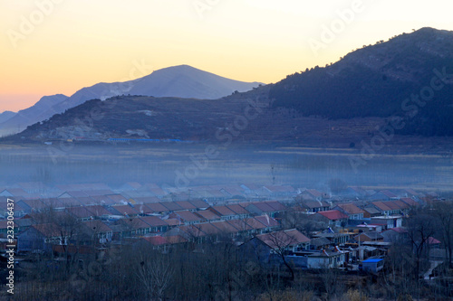 small mountain village scenery in the mist