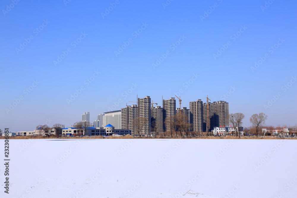 Unfinished high-rise buildings in the snow, Luannan county, hebei province, China Unfinished high-rise buildings in the snow, Luannan county, hebei province, China