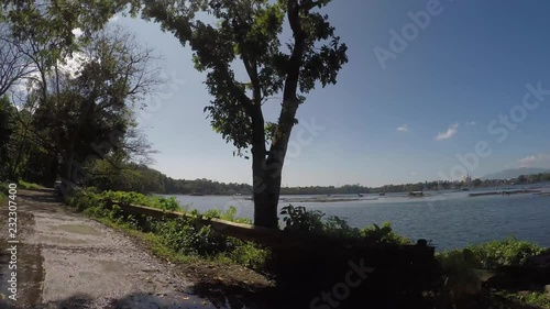 Sampaloc Lake, San Pablo City, Laguna, Philippines - February 20, 2018:  Trees and vegetation on mountain lake shore. Drone aerial. photo