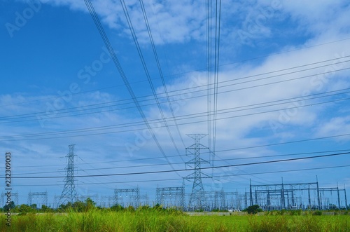 Electric high voltage post with blue sky background