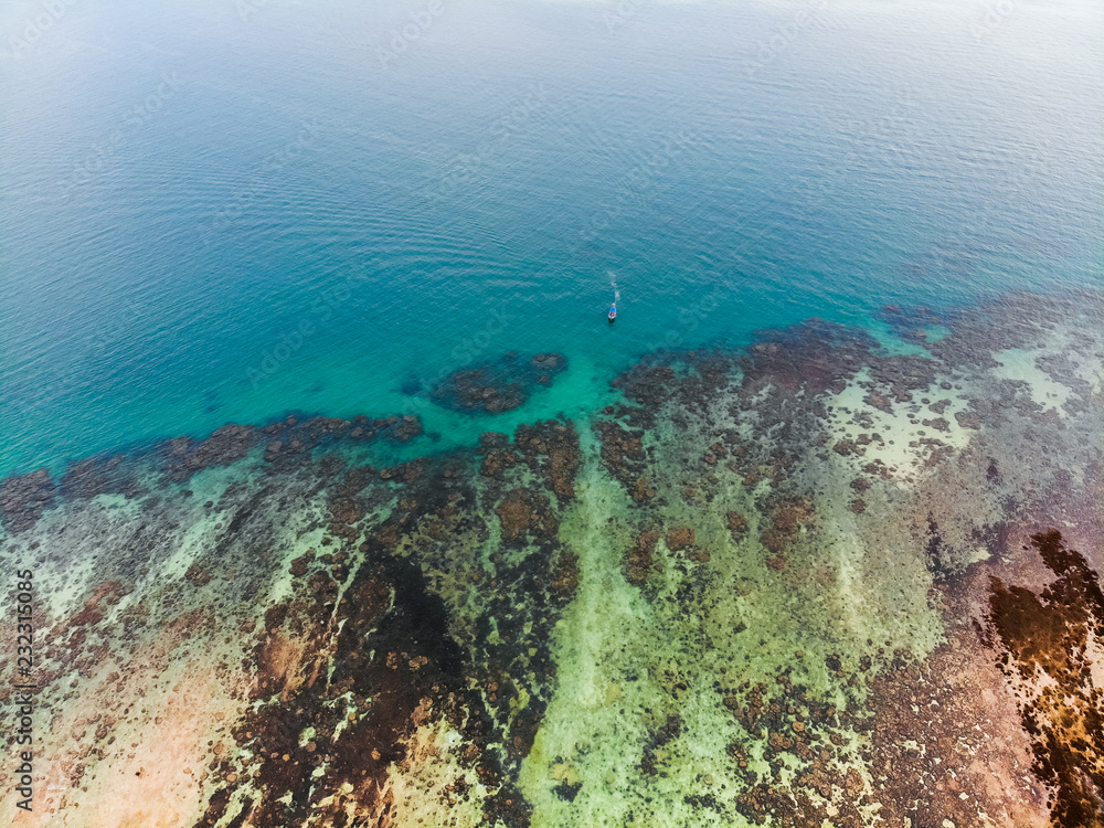 Fototapeta premium Sea and boat beach coast aerial view