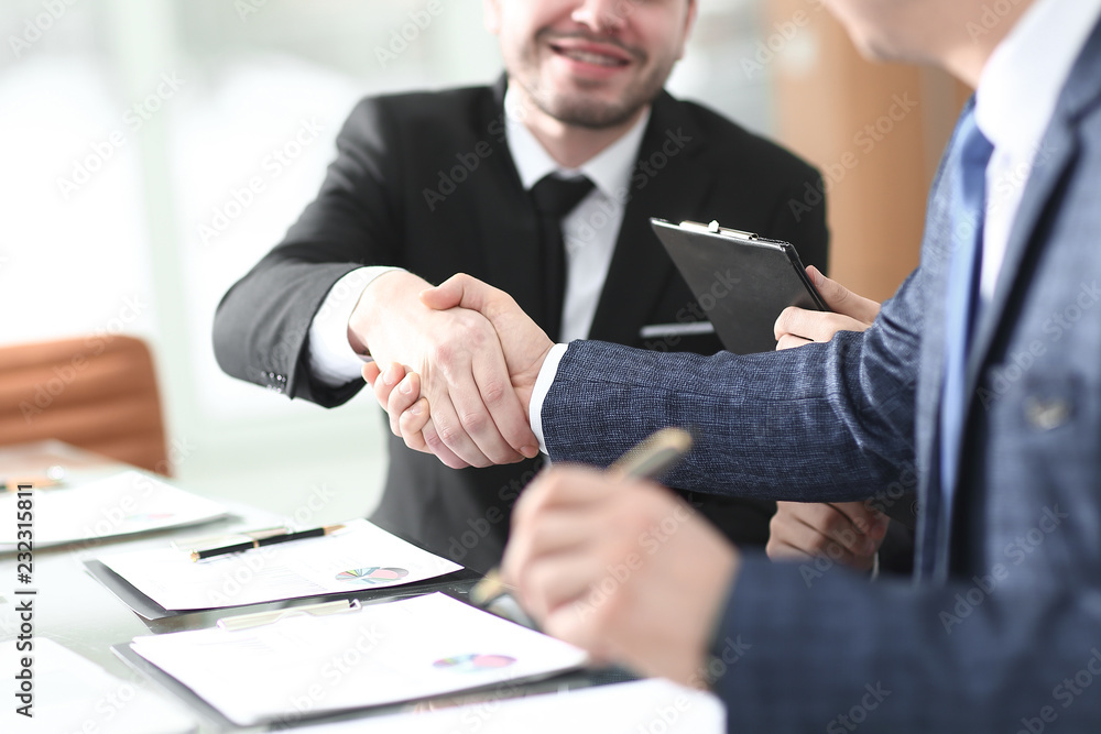 handshake of trading partners after discussing the terms of the contract handshake of trading partners after discussing the terms of the contract