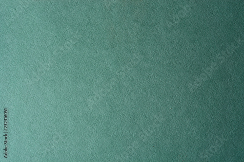 green paper texture background. colored cardboard fibers and grain