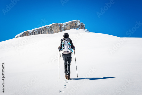Woman hiking in alps in winter