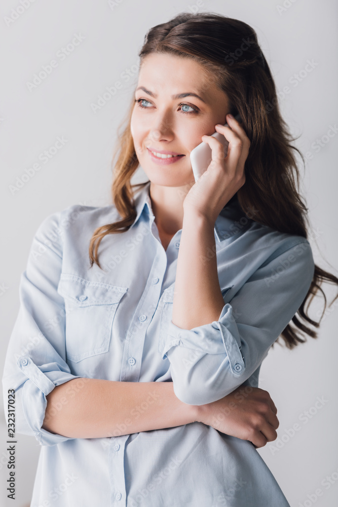 close-up portrait of smiling adult woman talking by phone and looking away close-up portrait of smiling adult woman talking by phone and looking away