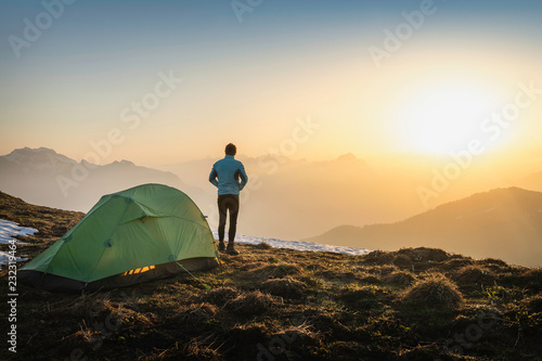 Hiker camping on French Alps, Parc naturel rí©gional du Massif des Bauges, Chatelard-en-Bauges, Rhone-Alpes, France photo