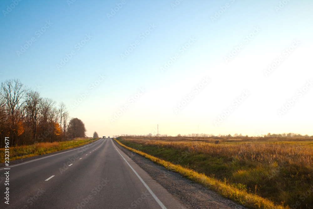 sunset over road going into the distance