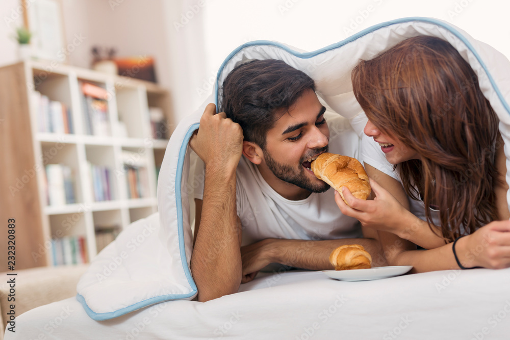 Couple's weekend breakfast in bed