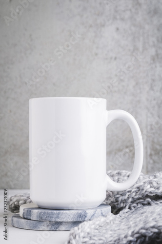 15 oz mug mockup with marble coasters and a grey blanket