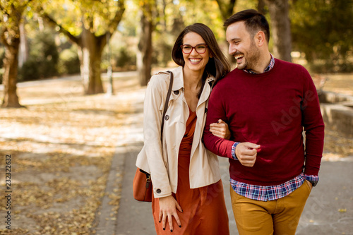 Young woman and man walking...