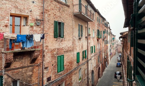 Domestic life of italians, houses with balconies and narrow streets of cities © radiokafka