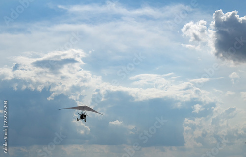 hang glider in the blue sky