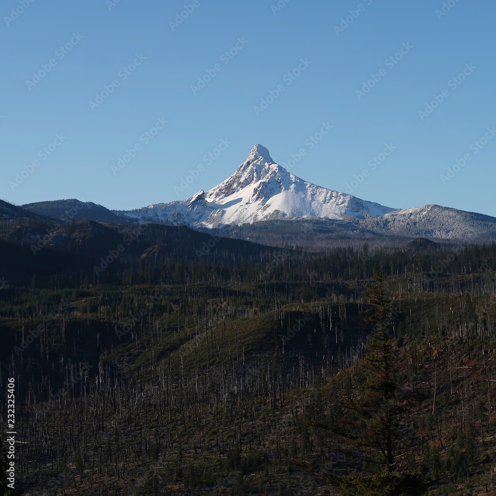 A fresh coat of snow covers the jagged peak of Mt. Washington in Oregon’s Cascade Mountain Range with clear blue skies on a cold winter morning. 