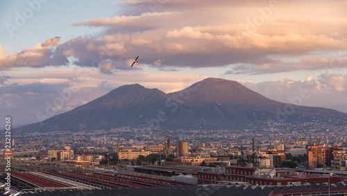Naples and volcano Vesuvius in the background and beautiful clouds over it. Amazing sunset. Italy