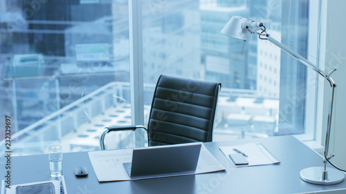 Fotografie High Angle Shot of a Working Desk of an Successful Person in Office with Cityscape Window View