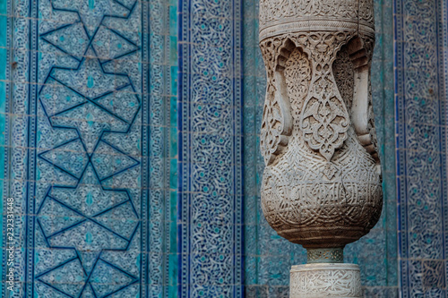 Khiva, Toshhovli, ornamental wooden column photo