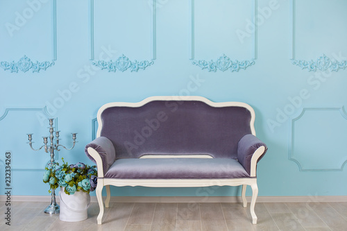 Cozy retro stylish home with decor inspired by designers and florist soul with royal colors. old fashion furniture chair in studio shoot with cosy paper flowers on background brown wall