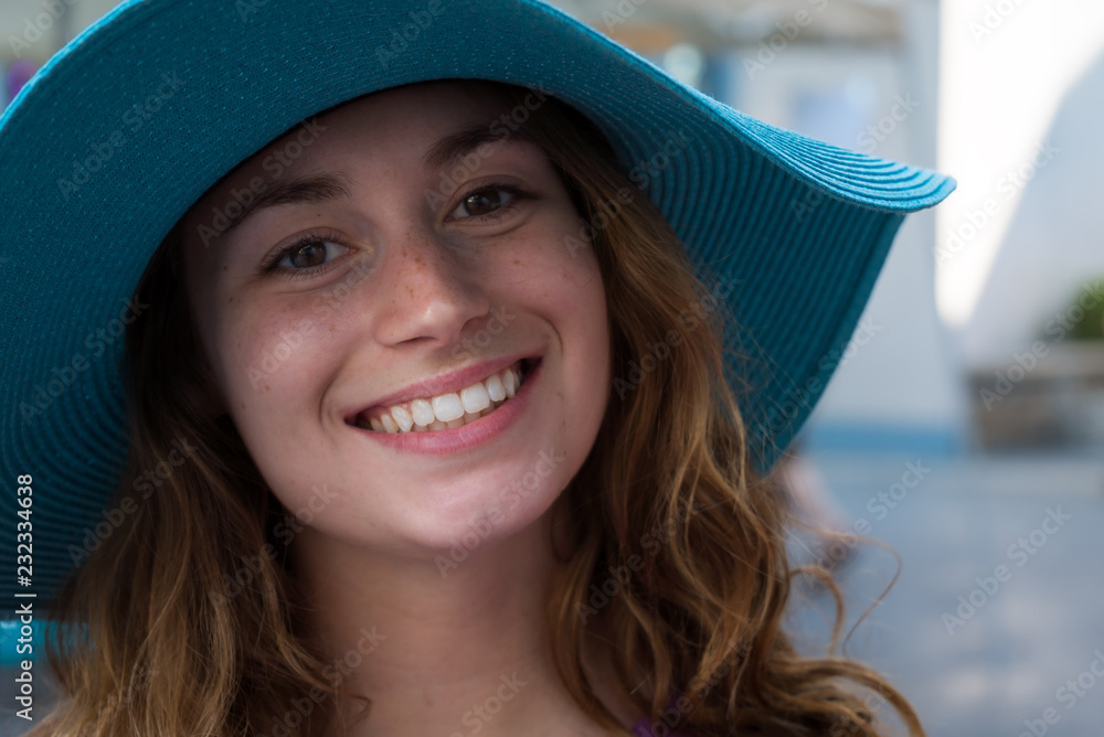 Portrait, woman in sunhat smiling Portrait, woman in sunhat smiling