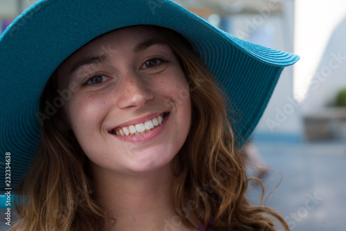 Portrait, woman in sunhat smiling photo