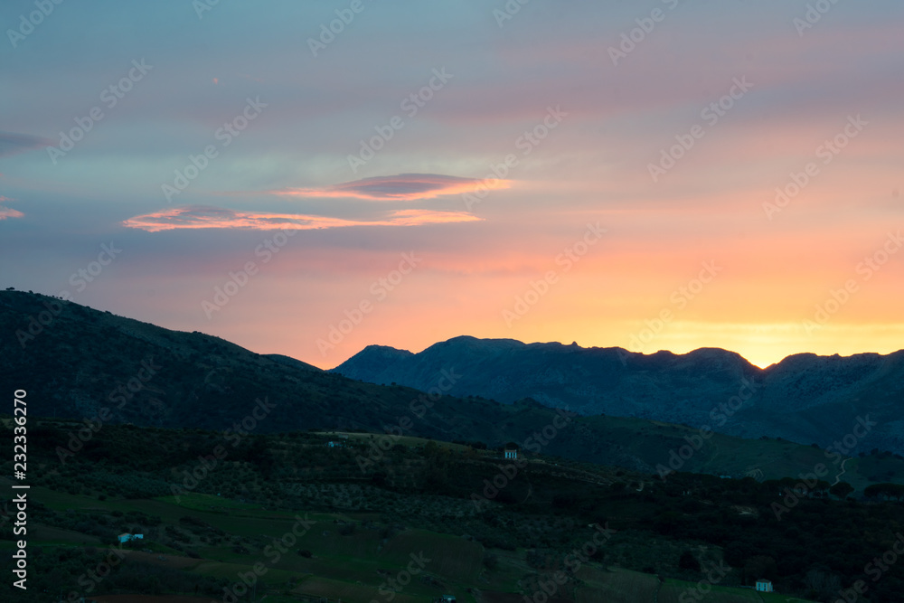 Panoramic sunset view on Tajo Gorge (Tajo de Ronda) in Ronda, Spain