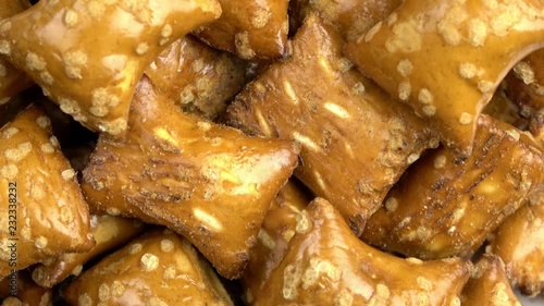 Peanut butter and pretzel rectangle snacks spinning video close up