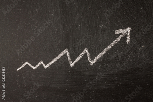 The arrow is a graph of the increase in profit by chalk on the board.