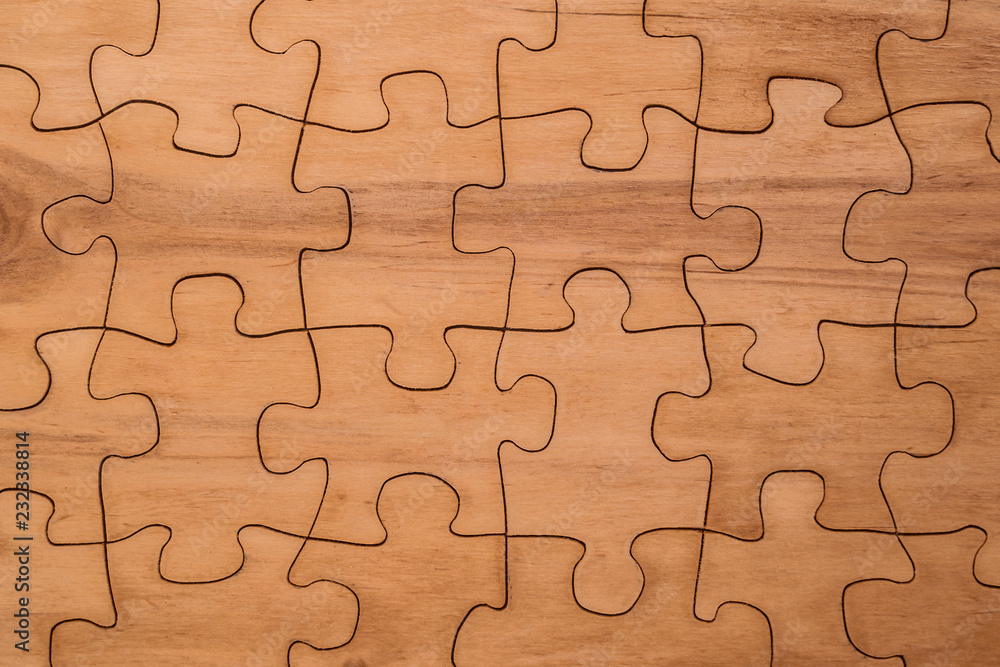assembled puzzles made of wood. the concept of integrity, logic, thinking. assembled puzzles made of wood. the concept of integrity, logic, thinking.