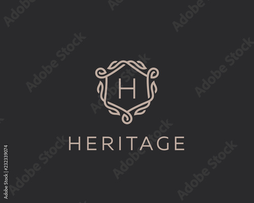 Premium linear shield monogram letter H logotype. Elegant crest leaf stamp icon vector logo. Luxury alphabet frame symbol.