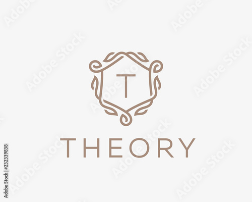 Premium linear shield monogram letter T logotype. Elegant crest leaf stamp icon vector logo. Luxury alphabet frame symbol.
