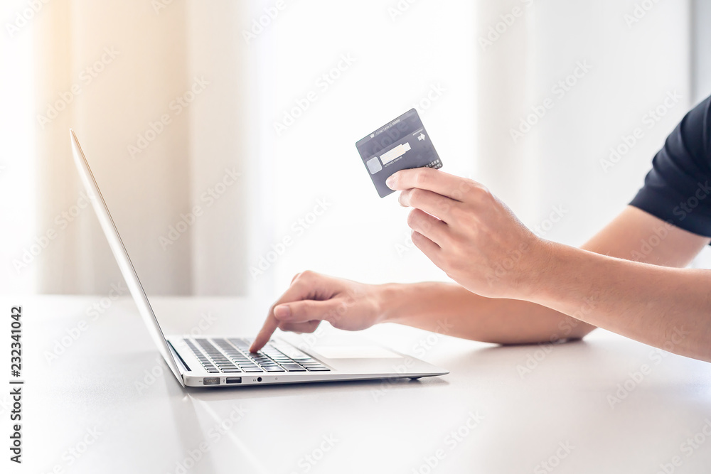 Online shopping concept, Close Up of hands holding credit card and using laptop, computer with blank copy space. Online shopping concept, Close Up of hands holding credit card and using laptop, computer with blank copy space.