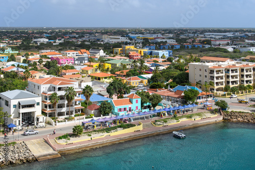Aerial view of the waterfront coastal tropical city with bright houses with tiled roof © DOF