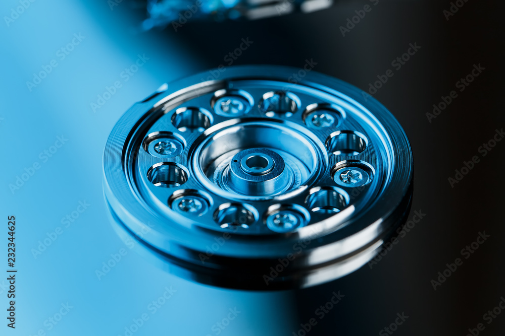 Disassembled hard drive from the computer, hdd with mirror effect. Opened hard drive from the computer hdd with mirror effects. Part of computer pc, laptop Disassembled hard drive from the computer, hdd with mirror effect. Opened hard drive from the computer hdd with mirror effects. Part of computer pc, laptop