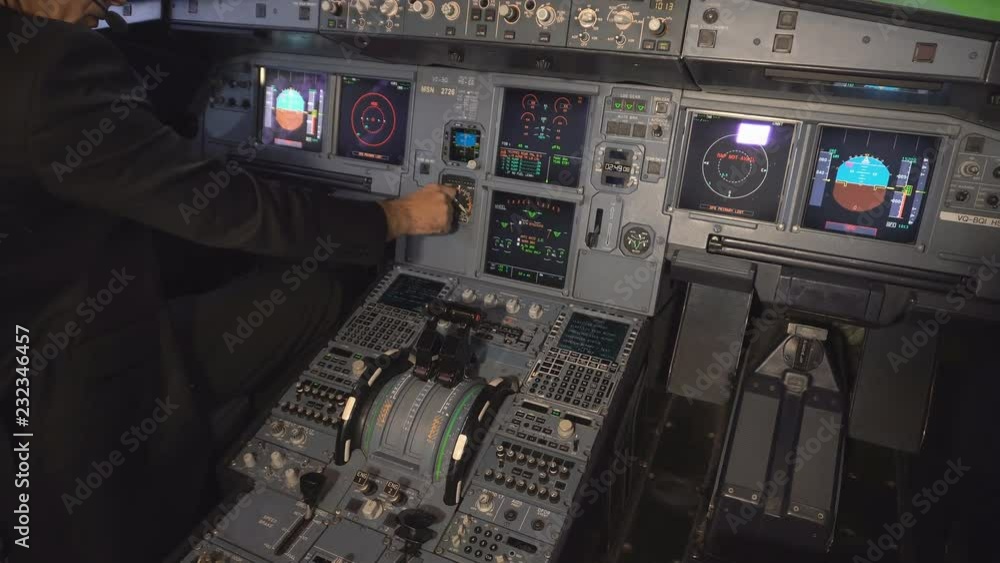 The cockpit of the aircraft. The pilot checks the electronics of the aircraft. Preparation of a passenger airliner for takeoff. The pilot checks the plane for flight. 4k The cockpit of the aircraft. The pilot checks the electronics of the aircraft. Preparation of a passenger airliner for takeoff. The pilot checks the plane for flight. 4k