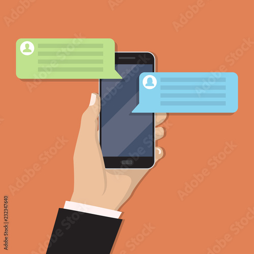 Hand holding smartphone with chat message in a flat design