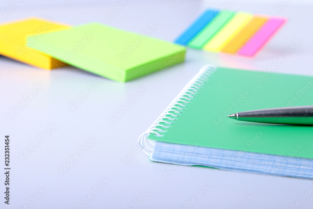 Business concept. Top view of kraft spiral notebook, glasses and pen isolated on background for mockup. Business concept. Top view of kraft spiral notebook, glasses and pen isolated on background for mockup.