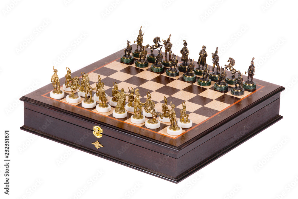 Chess Board with metal pieces on white background Chess Board with metal pieces on white background