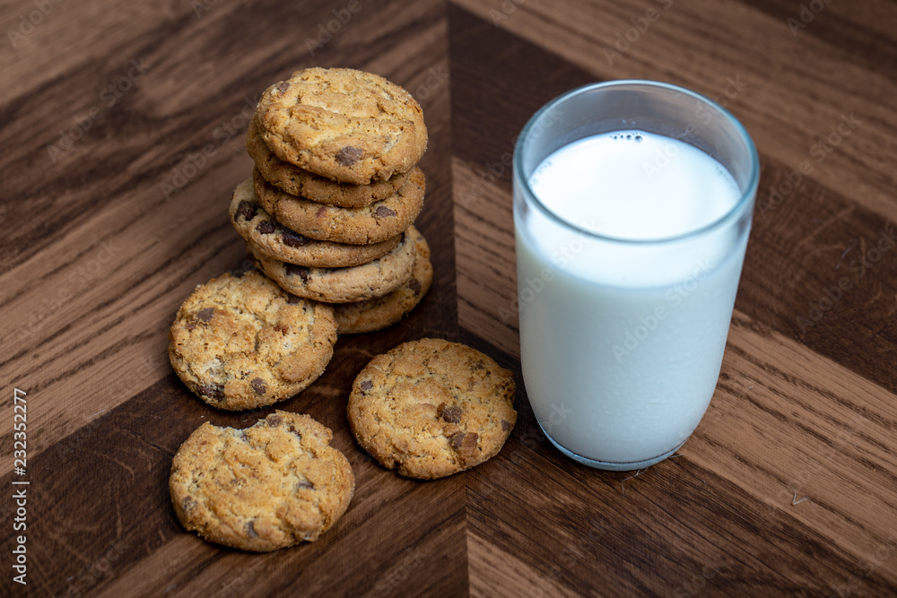 Photograph of a glass of milk with homemade cookies. American type cookie, tasty and very beautiful. Photograph of a glass of milk with homemade cookies. American type cookie, tasty and very beautiful.