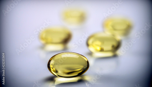 Capsules of fish oil with three omega, conceptual image