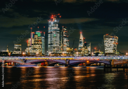 London Blackfriars bridge skyscraper view by night over river thames photo