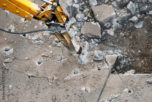 Heavy construction equipment works on the construction and repair of roads.