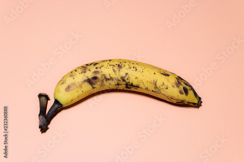 One ripe banana isolated on powdery background. pastel background
