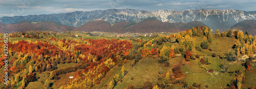 Amazing panorama of colorful hills and mountains in Transylvania during autumn photo